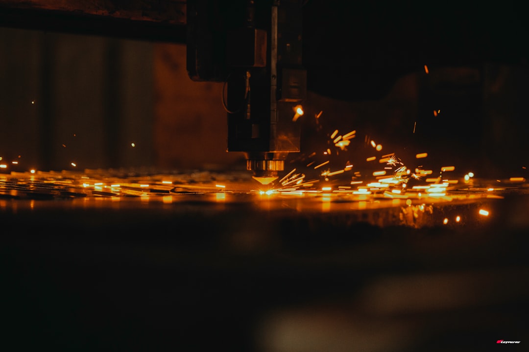 a close up of a machine cutting a piece of metal